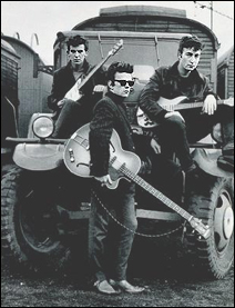 The Beatles in Hamburg, Germany in the early 1960s. Left to right: George Harrison, Stu Sutcliffe, and John Lennon.